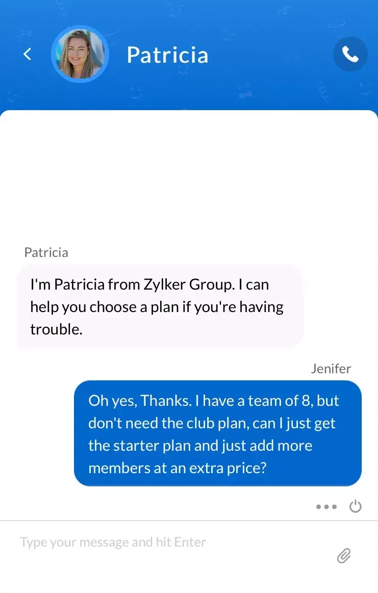 Chat widget header showing “Patricia” with her profile photo. Patricia says “I’m Patricia from Zylker Group. I can help you choose a plan if you’re having trouble.” The user Jenifer replies “Oh yes, thanks. I have a team of 8, but don’t need the club plan, can I just get the starter plan and just add more members at an extra price?” A text input field at the bottom prompts “Type your message and hit Enter.”